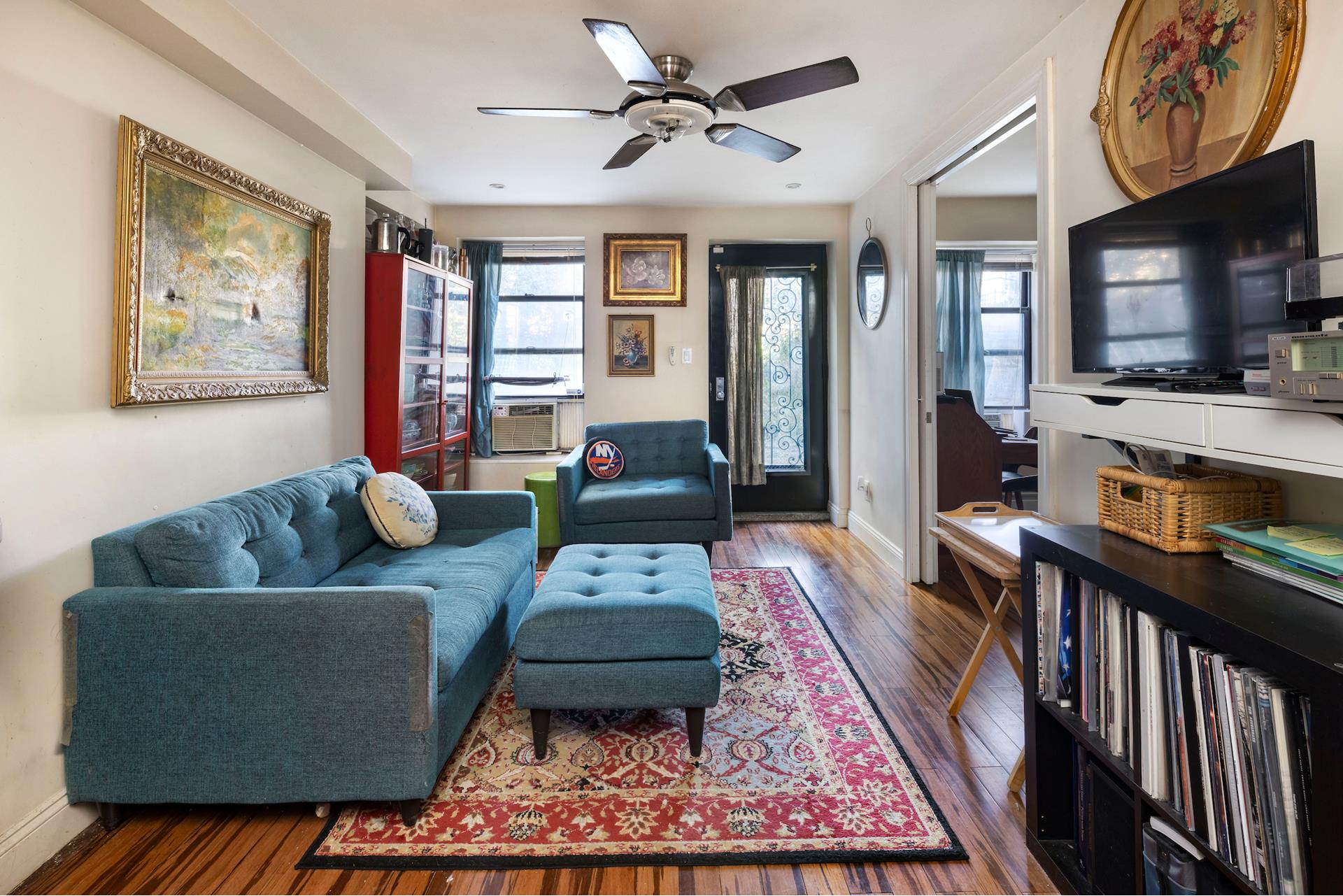 a living room with furniture and a flat screen tv