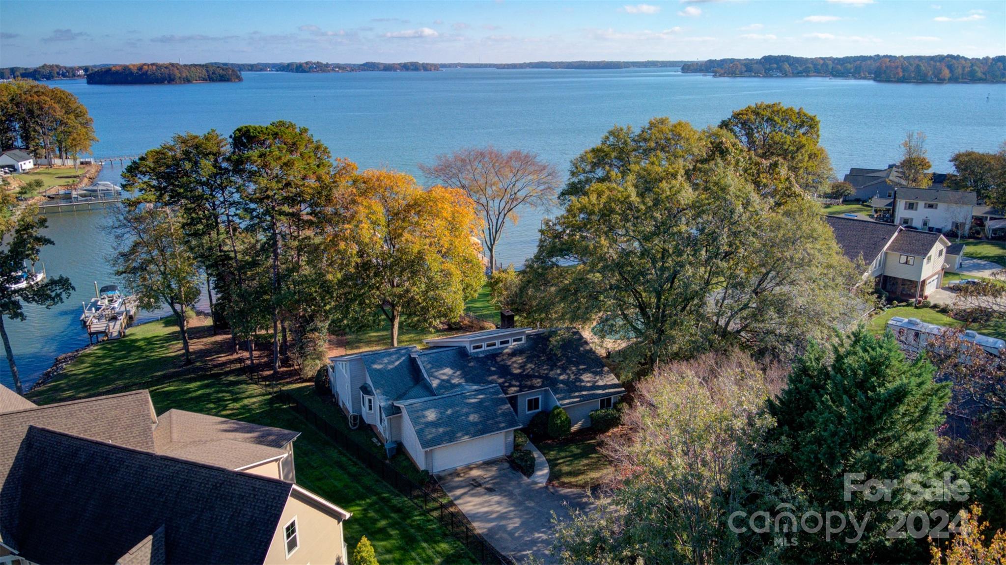 an aerial view of a house with lake view