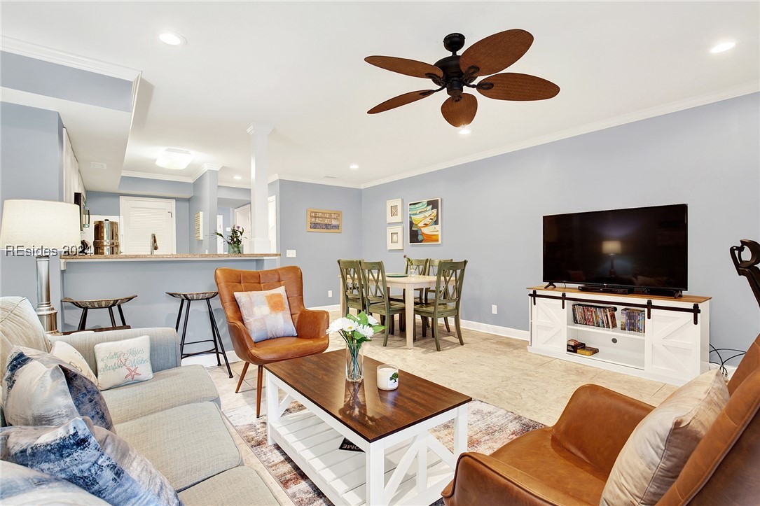 Living room featuring ceiling fan