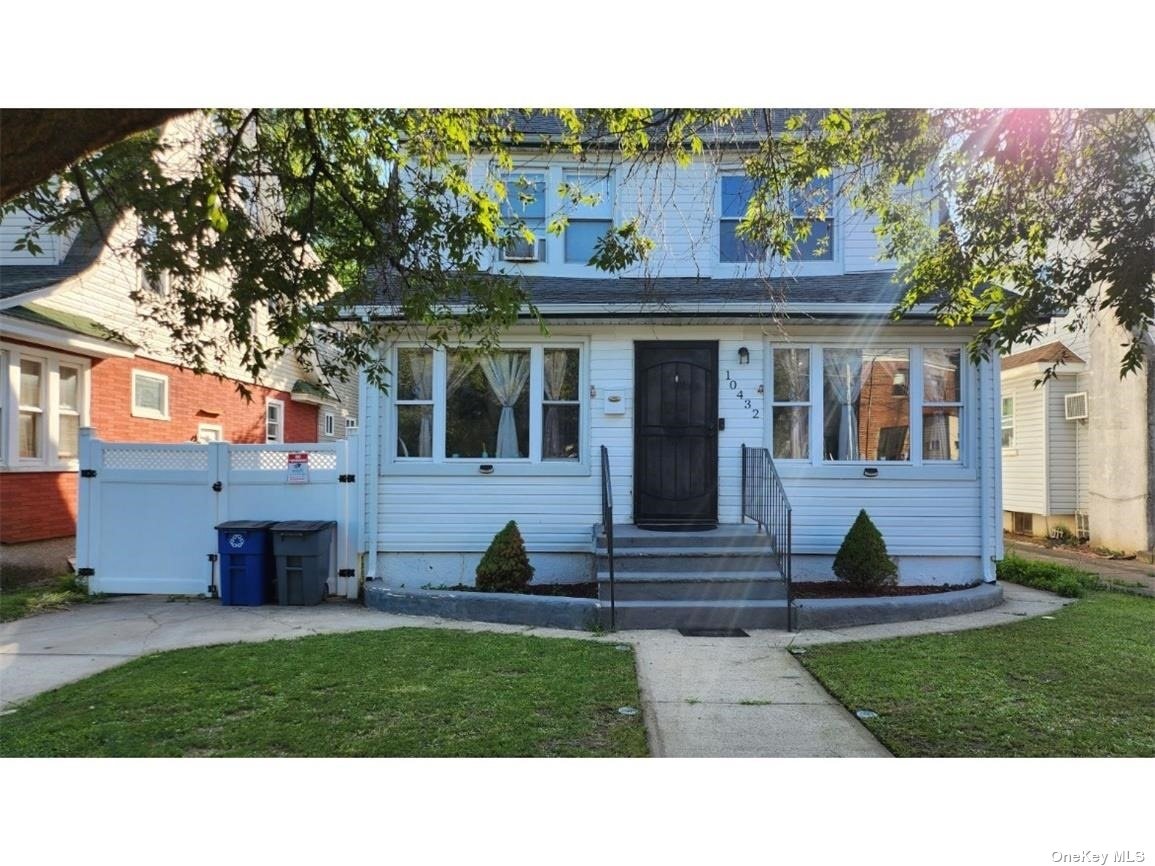 a view of house with yard