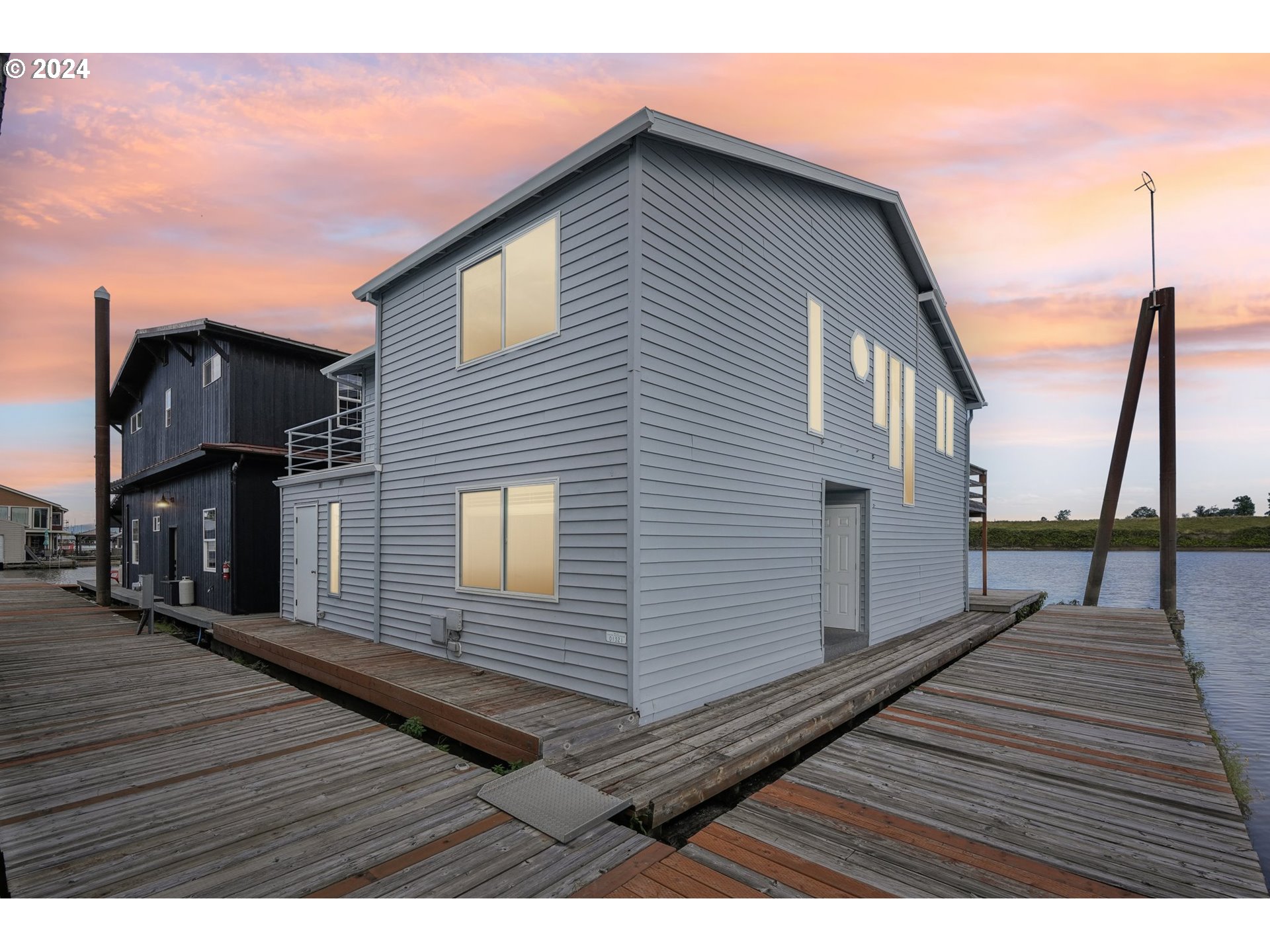 a view of a house with wooden deck