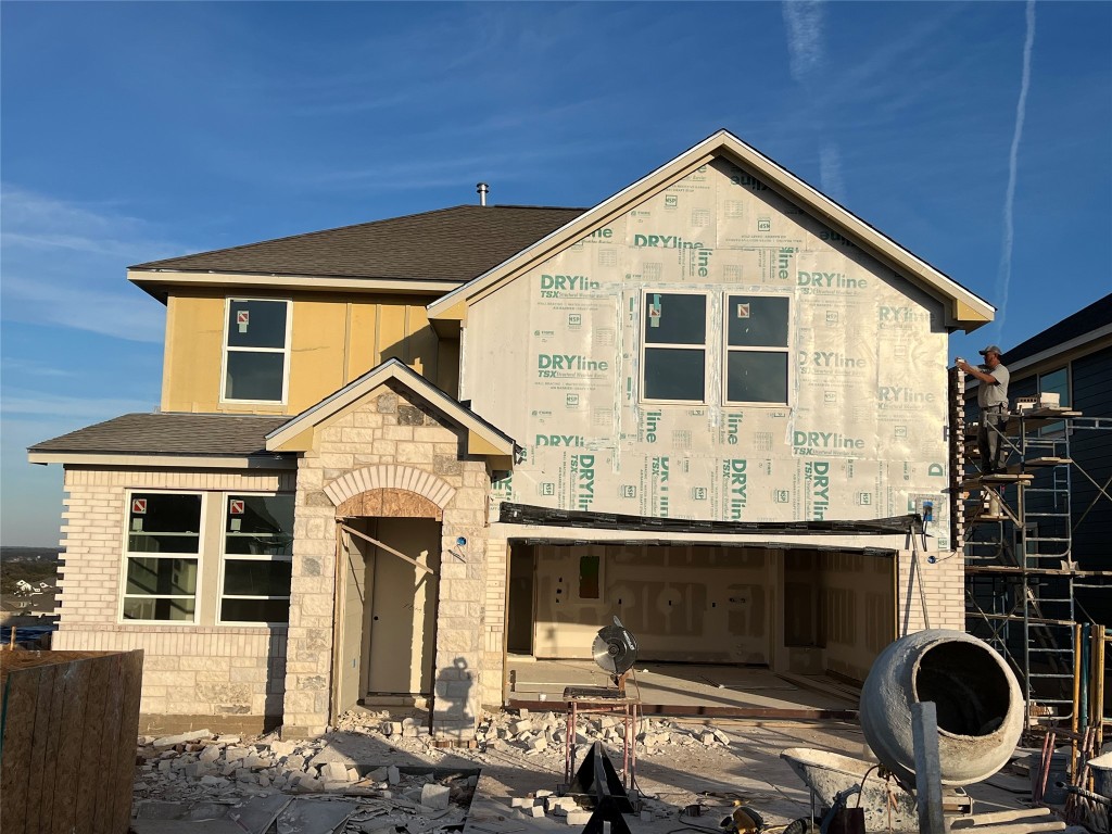 a front view of a house with yard