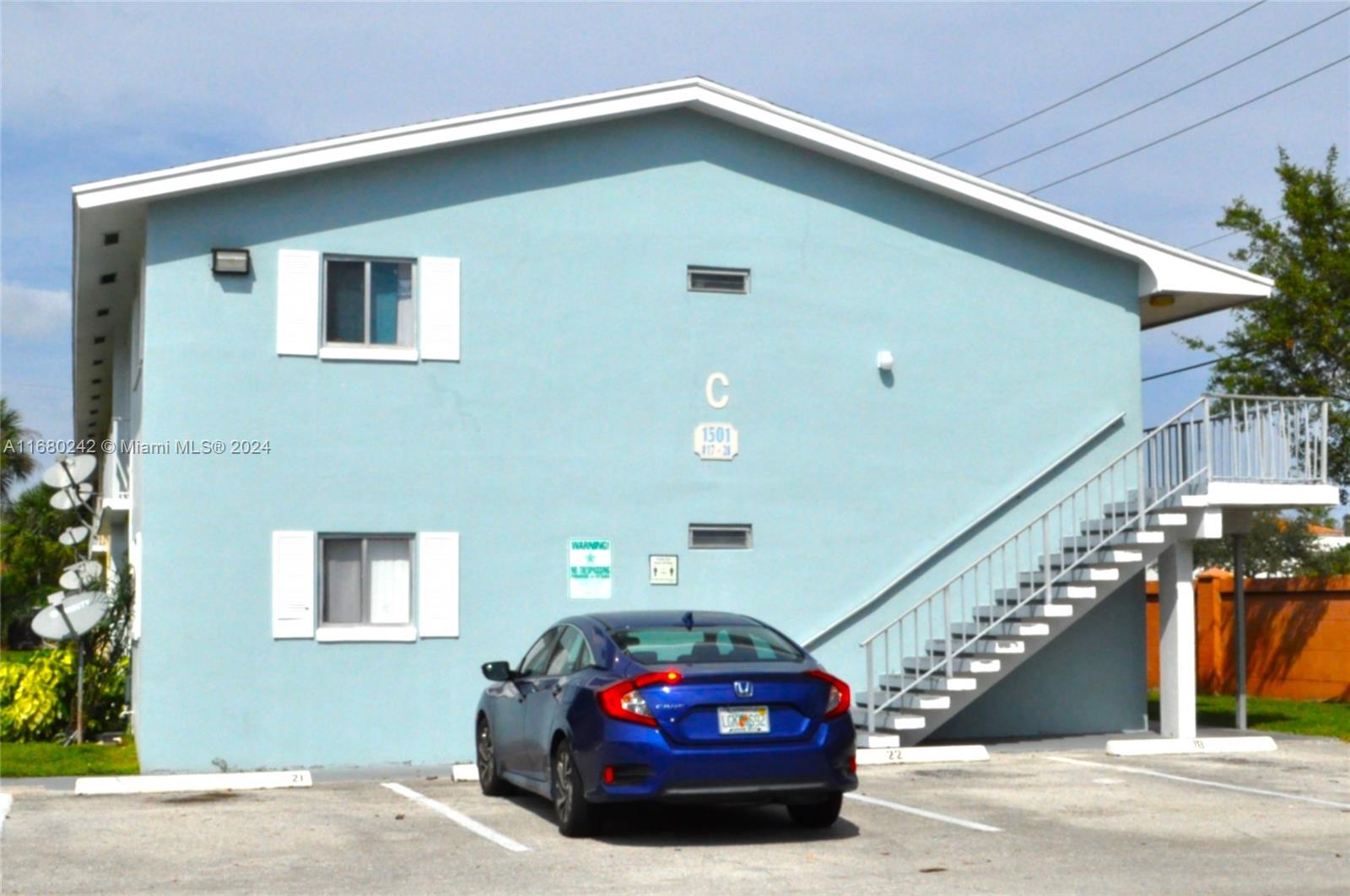 a front view of a house with stairs