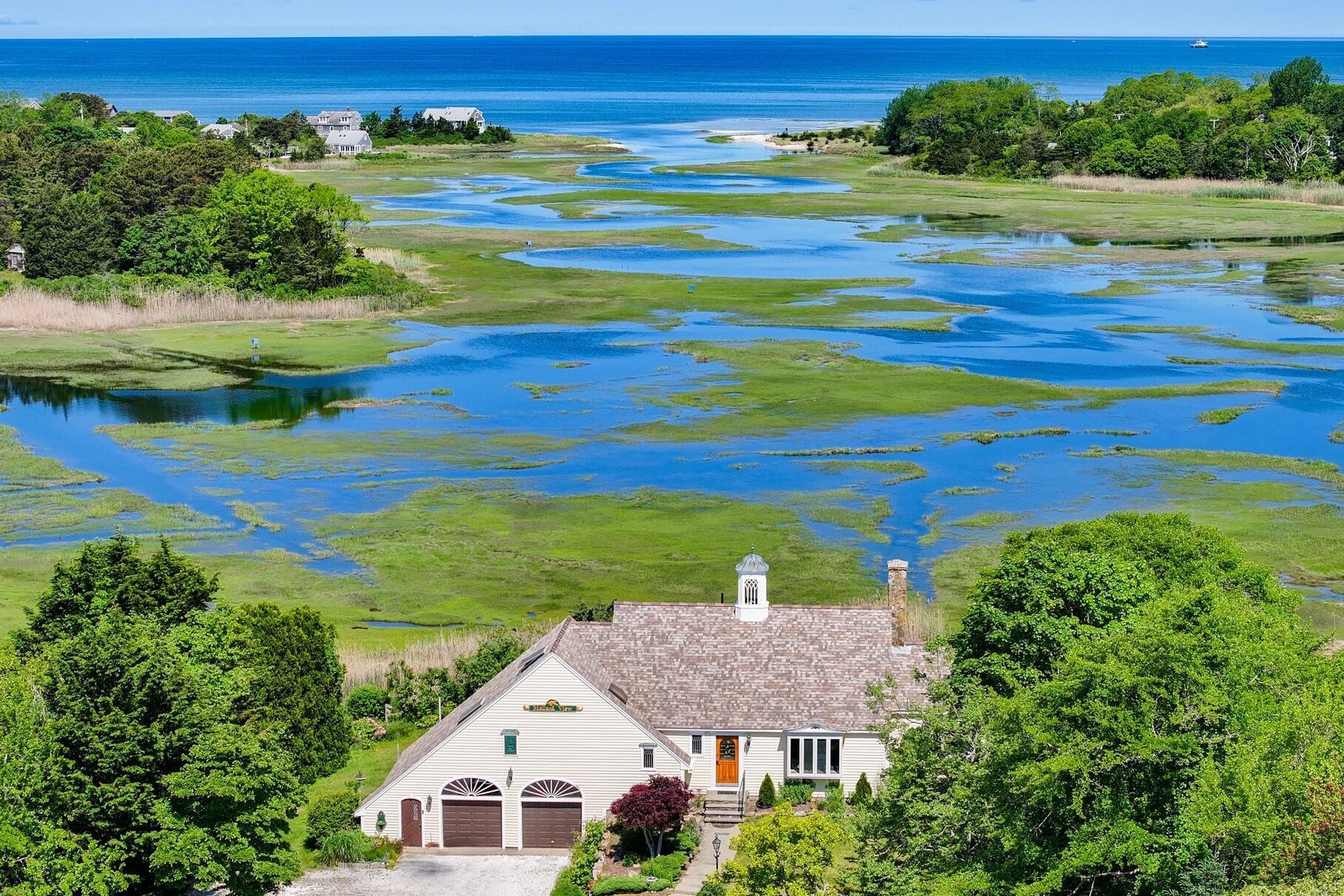 a aerial view of a house with a yard