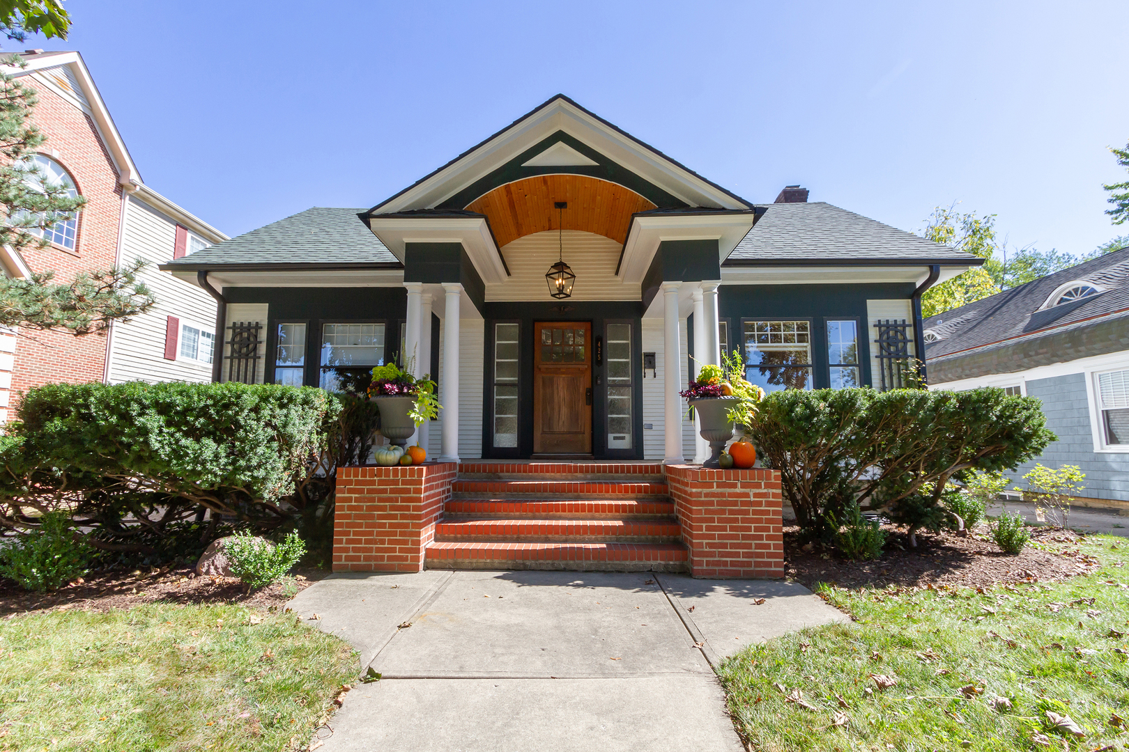 a front view of a house with garden