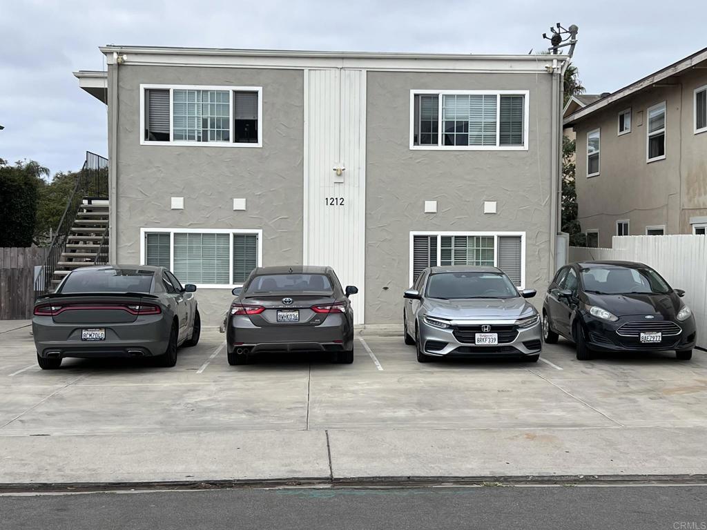 a view of cars parked in front of a house