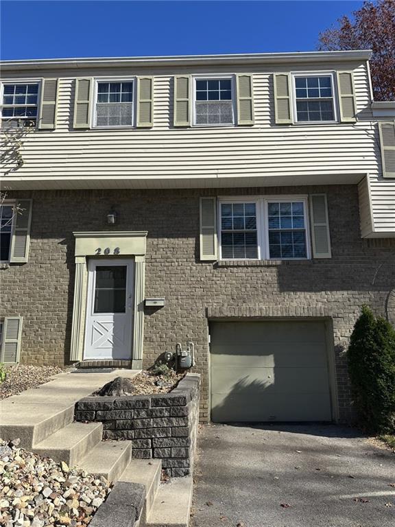 a front view of a house with yard