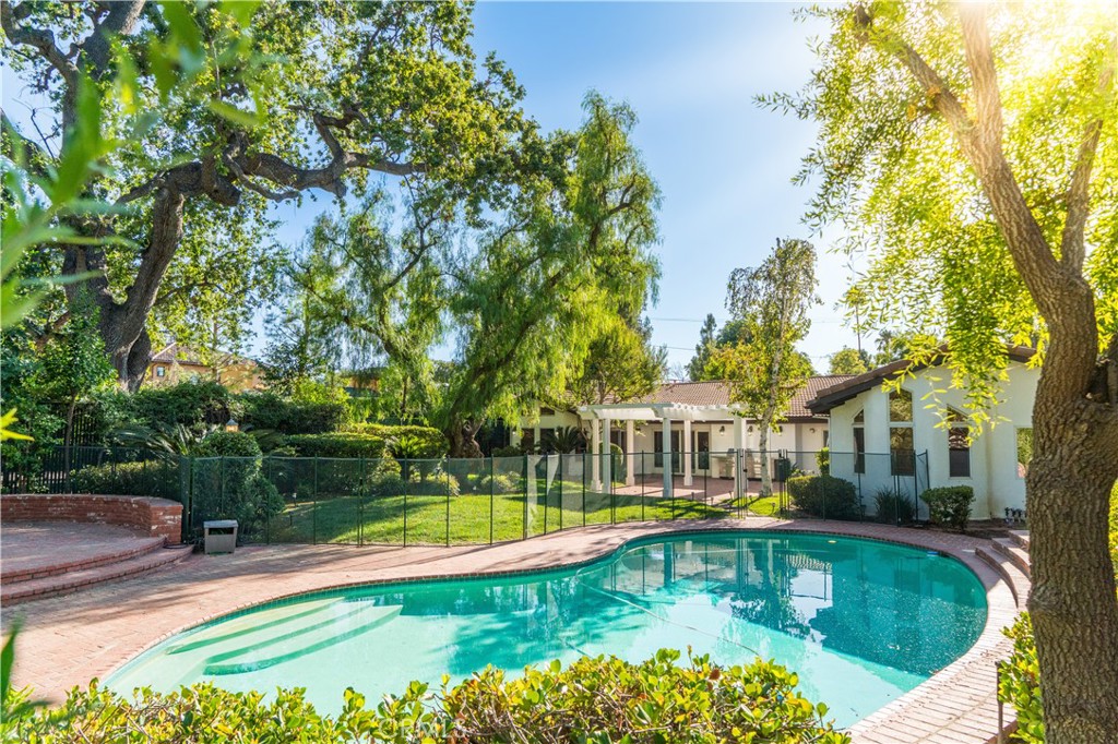 a view of a swimming pool with a patio