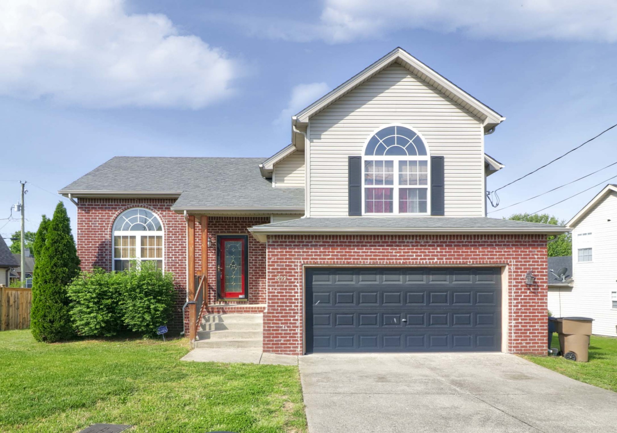 a front view of a house with a yard