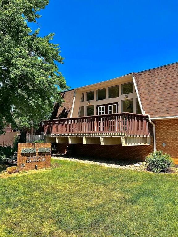 a view of a house with a yard balcony