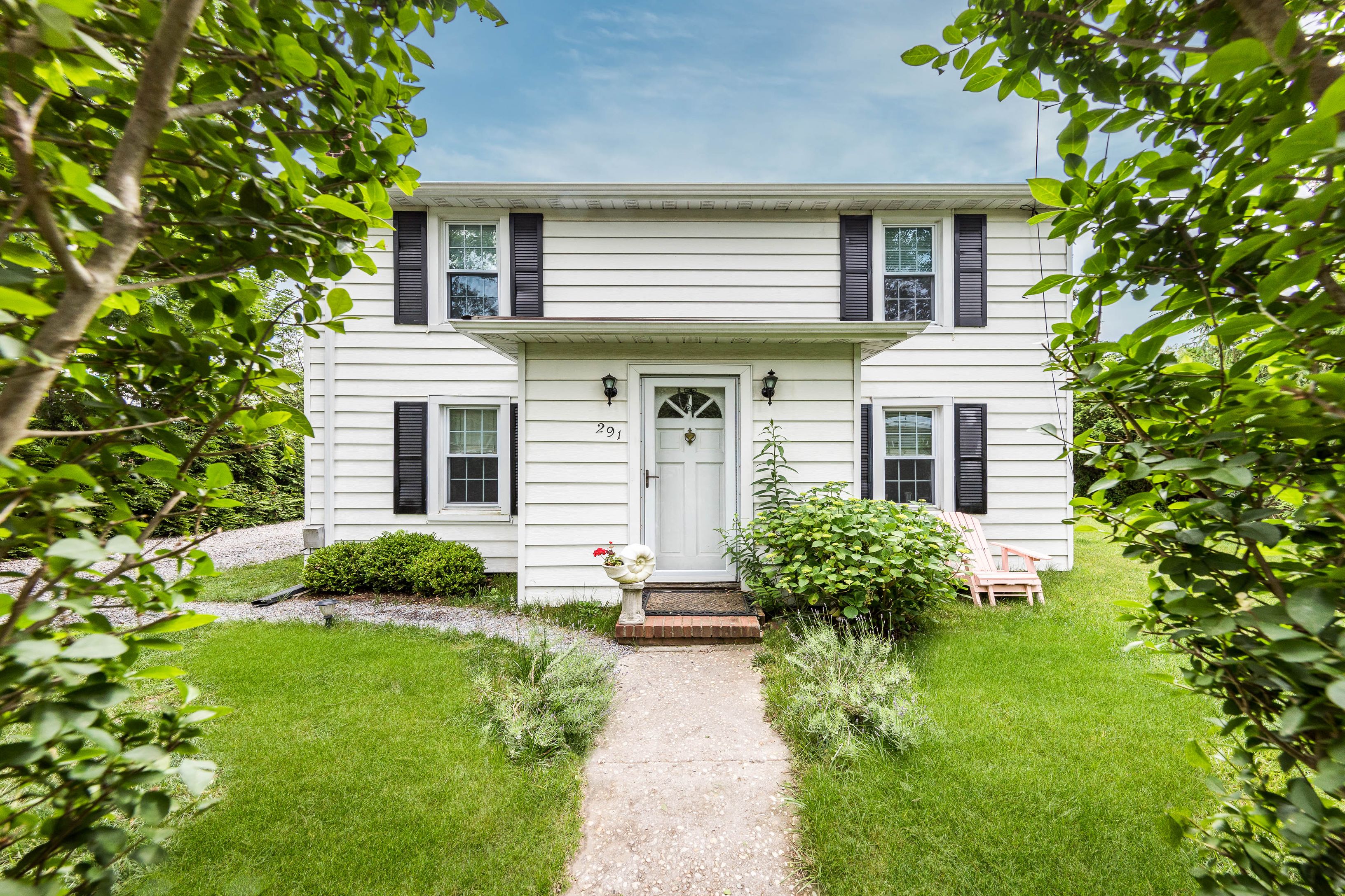 a front view of a house with garden