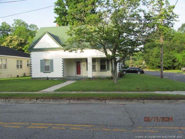 a front view of a house with a yard