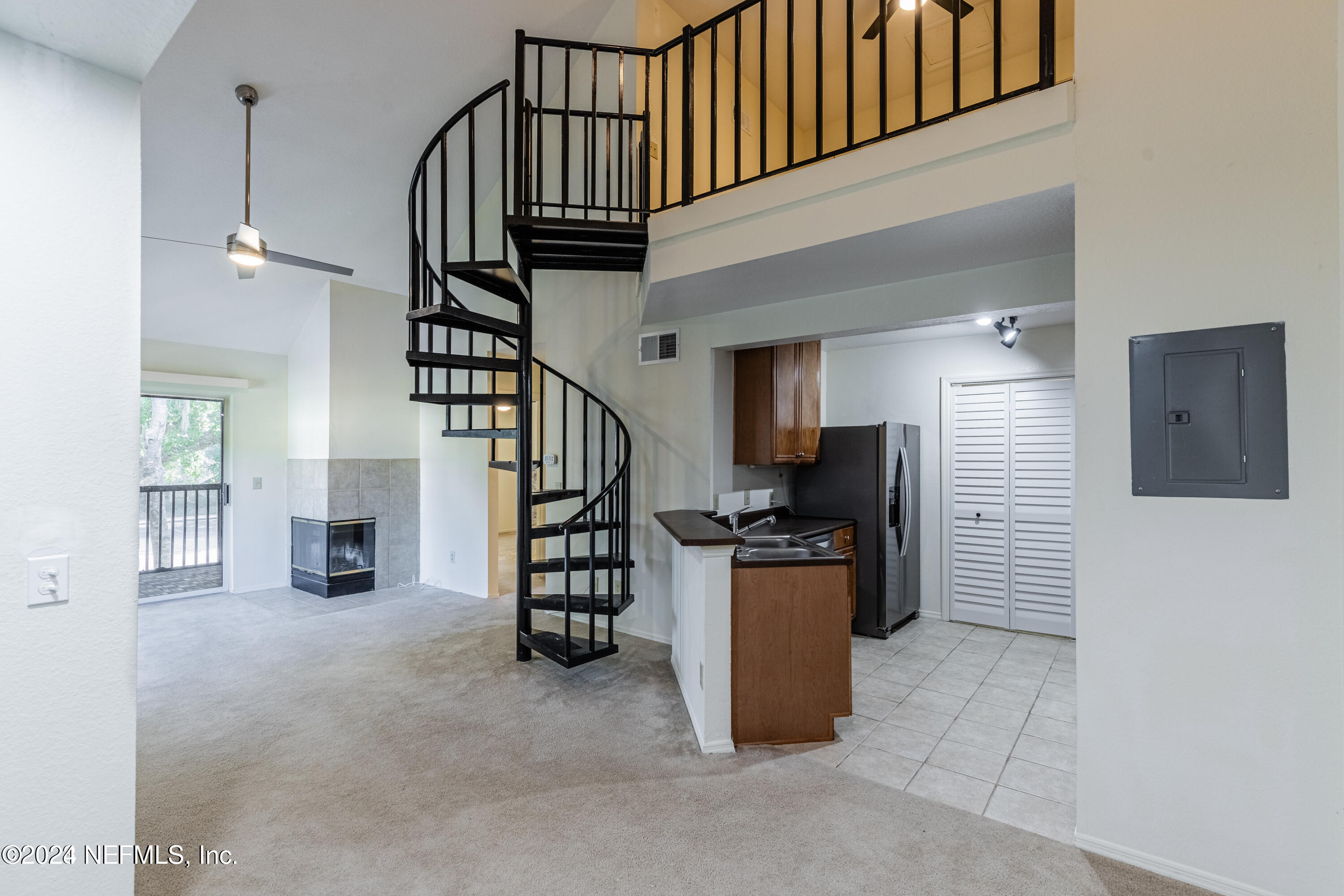 a view of a hallway with seating area