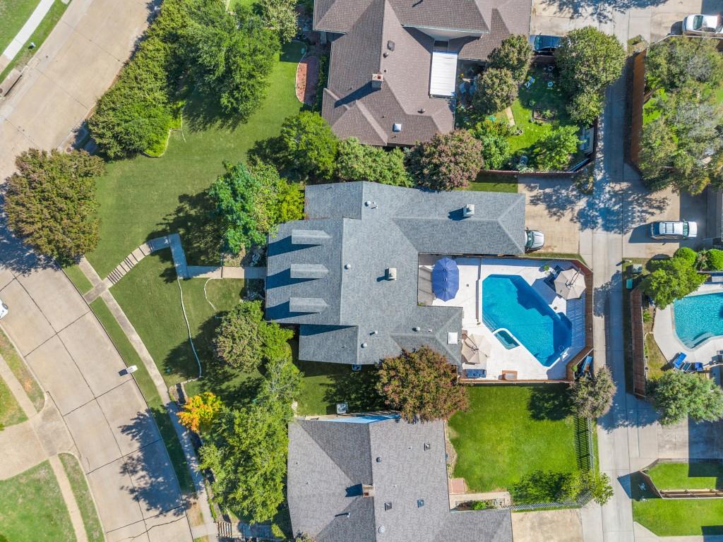 an aerial view of multiple houses with outdoor space