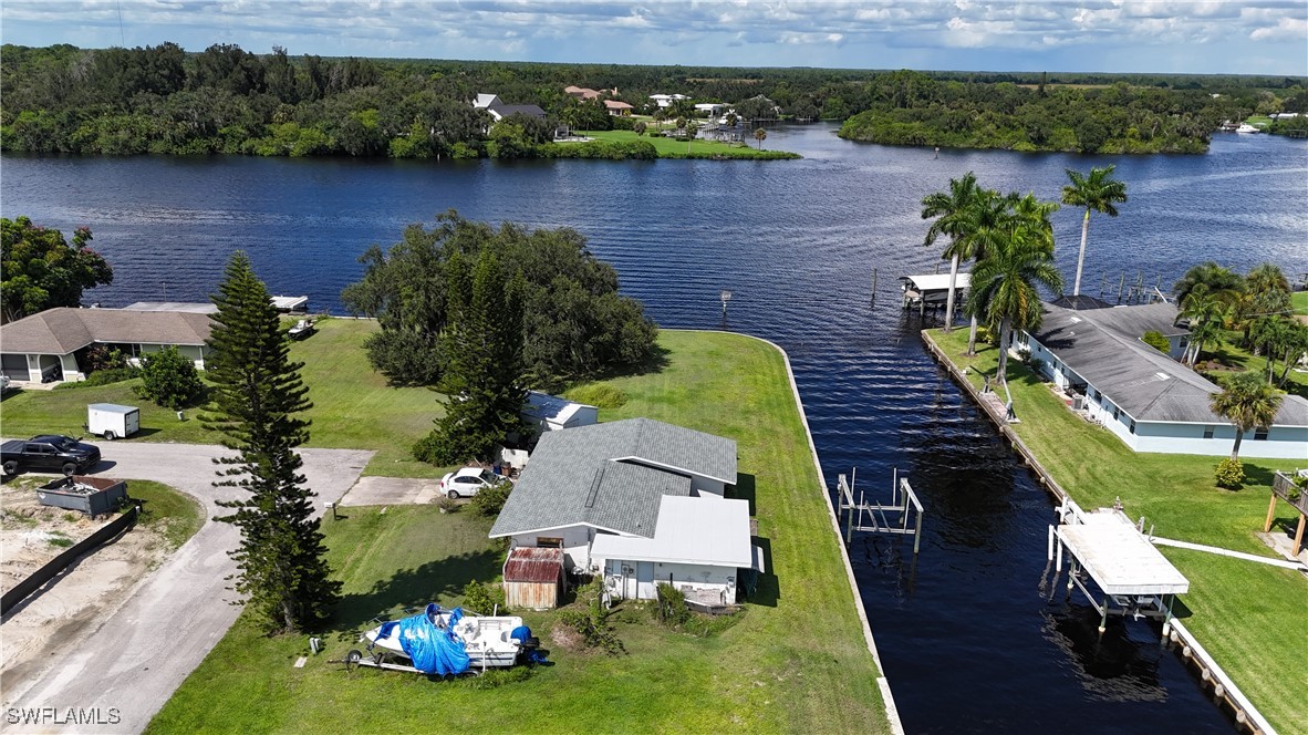 an aerial view of a house with a lake view