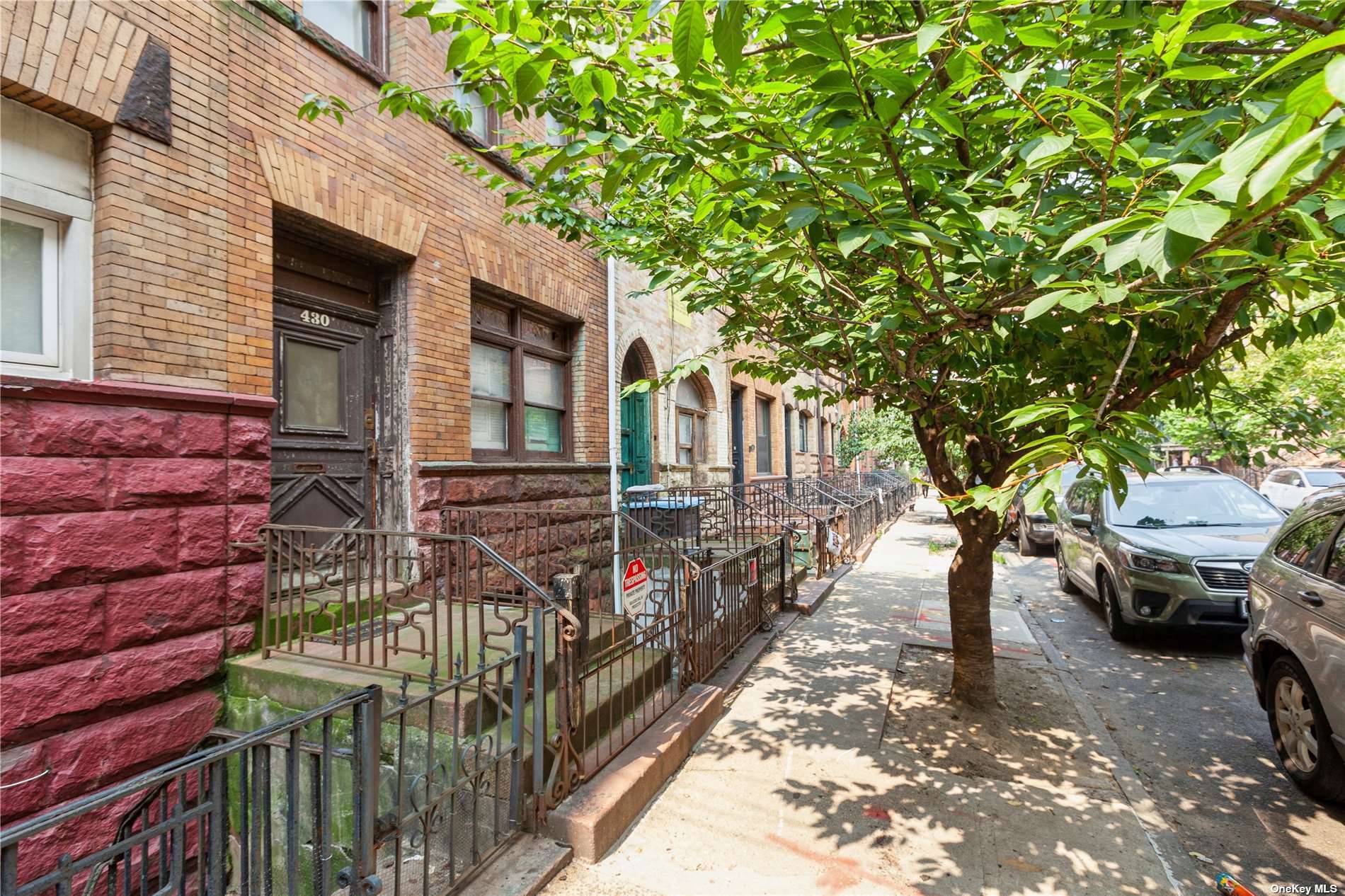 a view of street from balcony