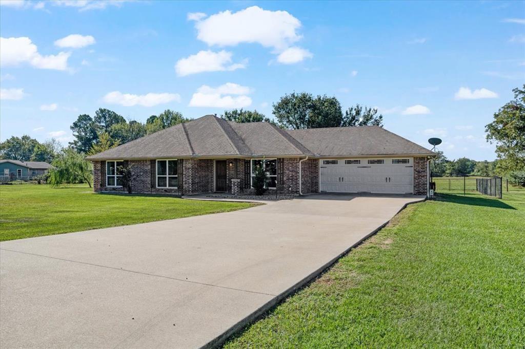 a front view of a house with yard