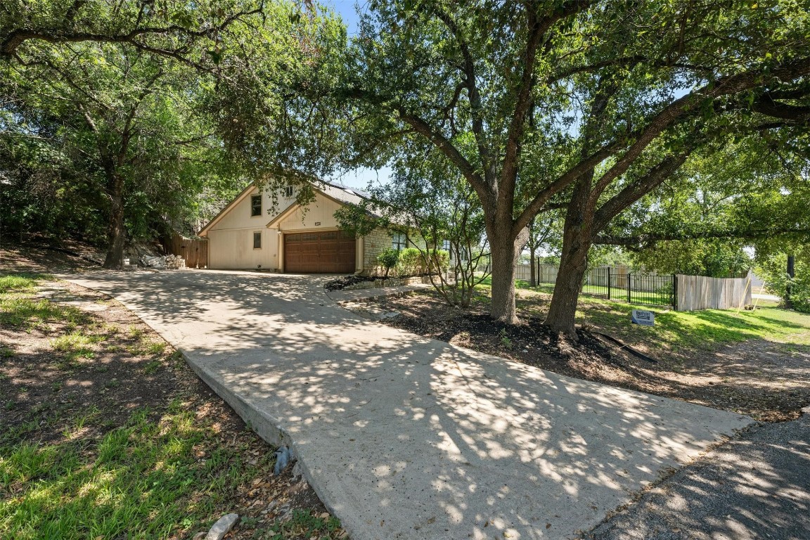 a view of a house with a tree in the background