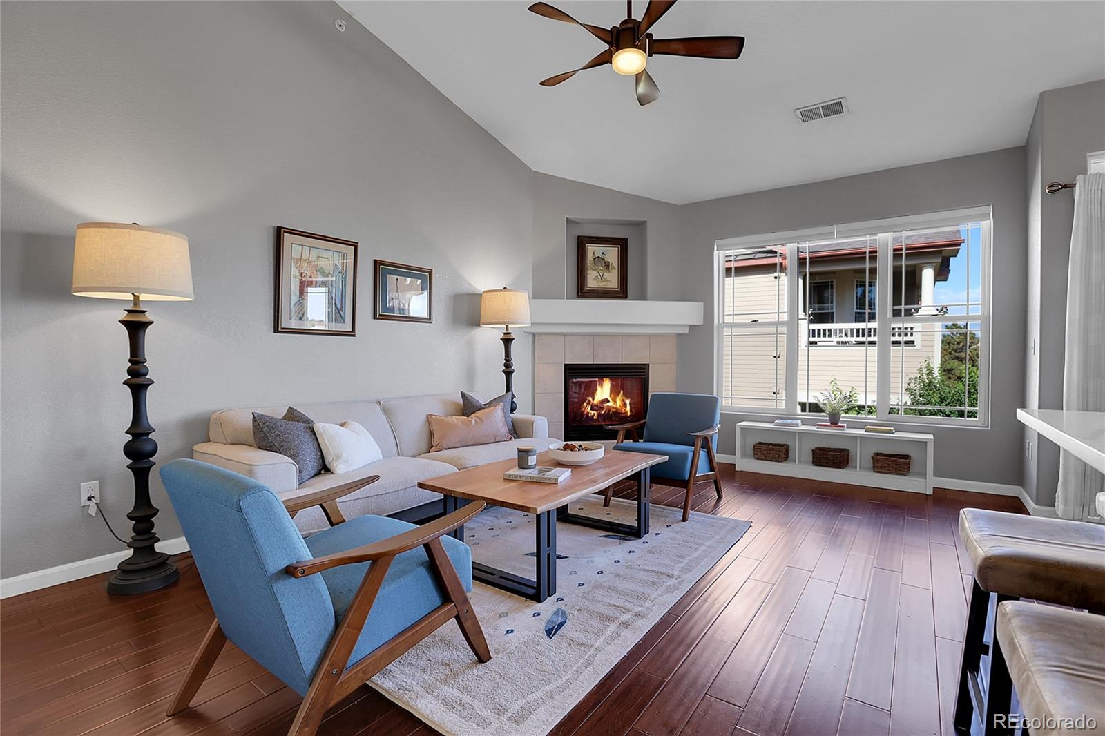 a living room with a couch and a fireplace