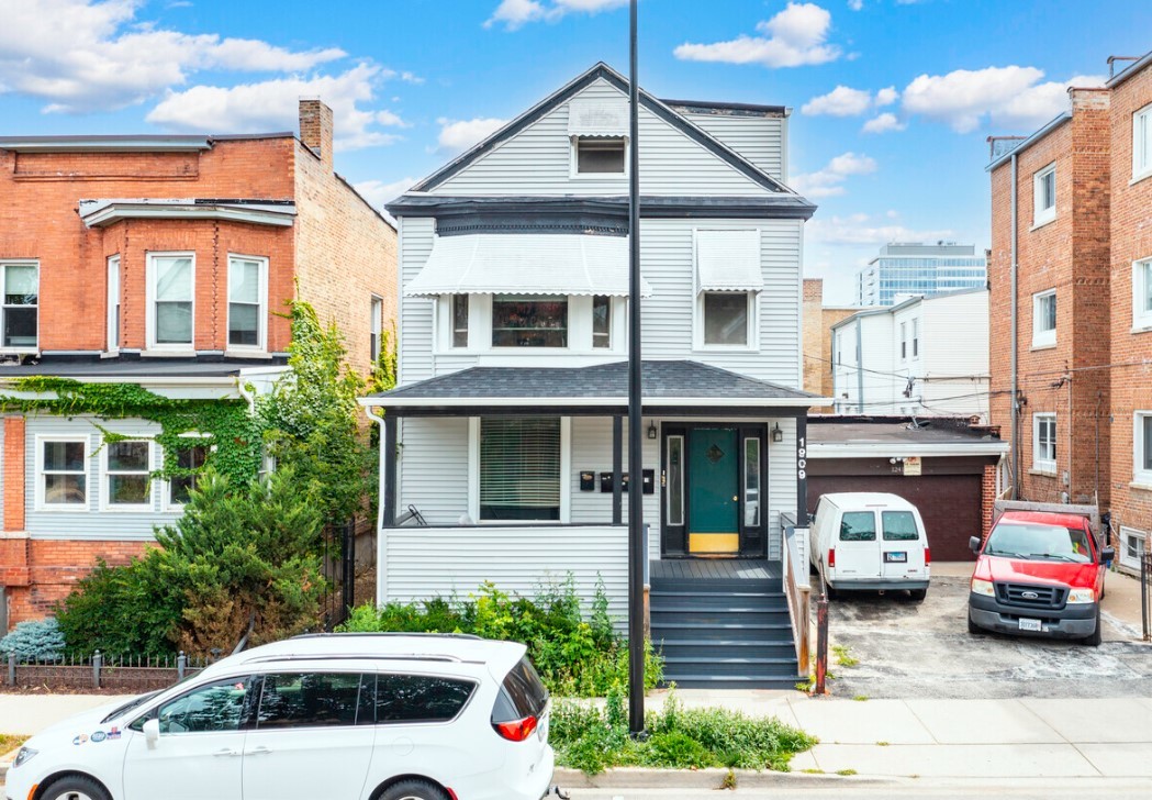 a car parked in front of a house