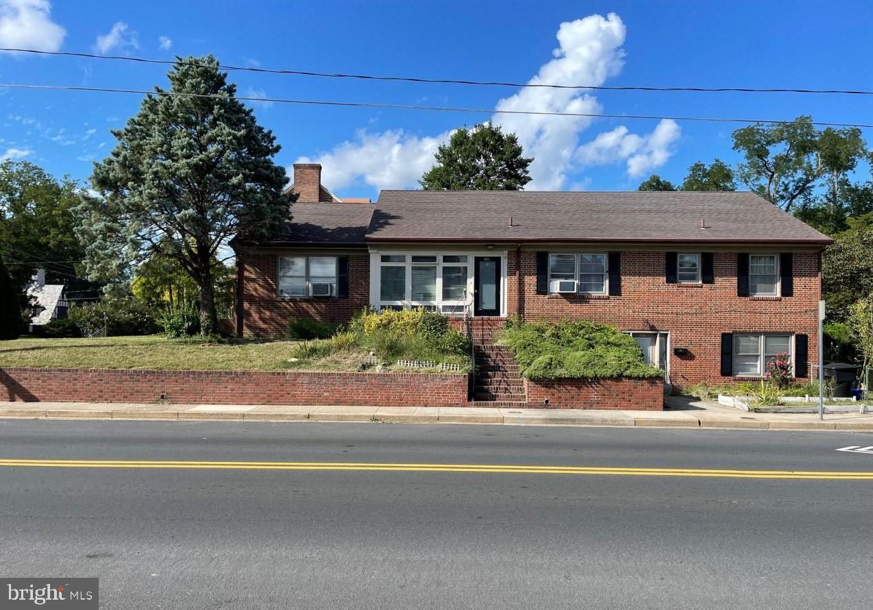 a view of a house with a garden