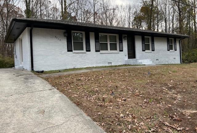 a house with trees in the background