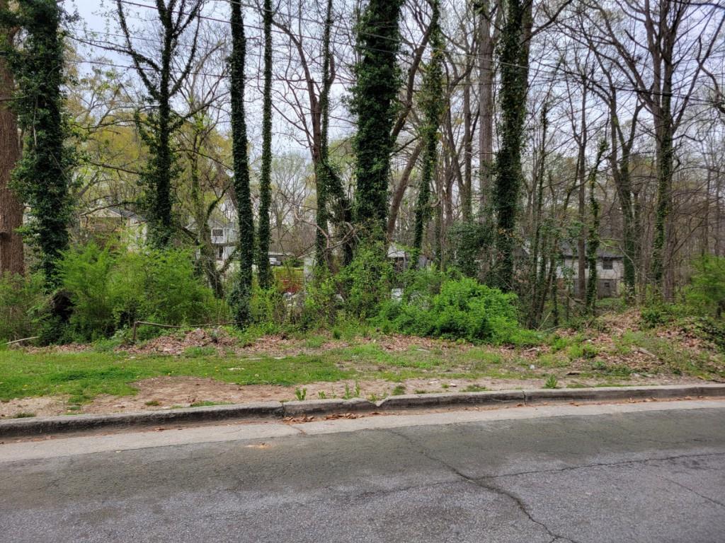 a backyard of a house with large trees