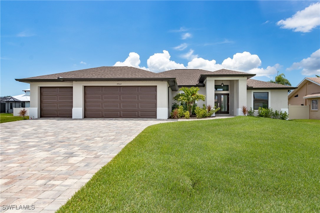 a front view of a house with a yard