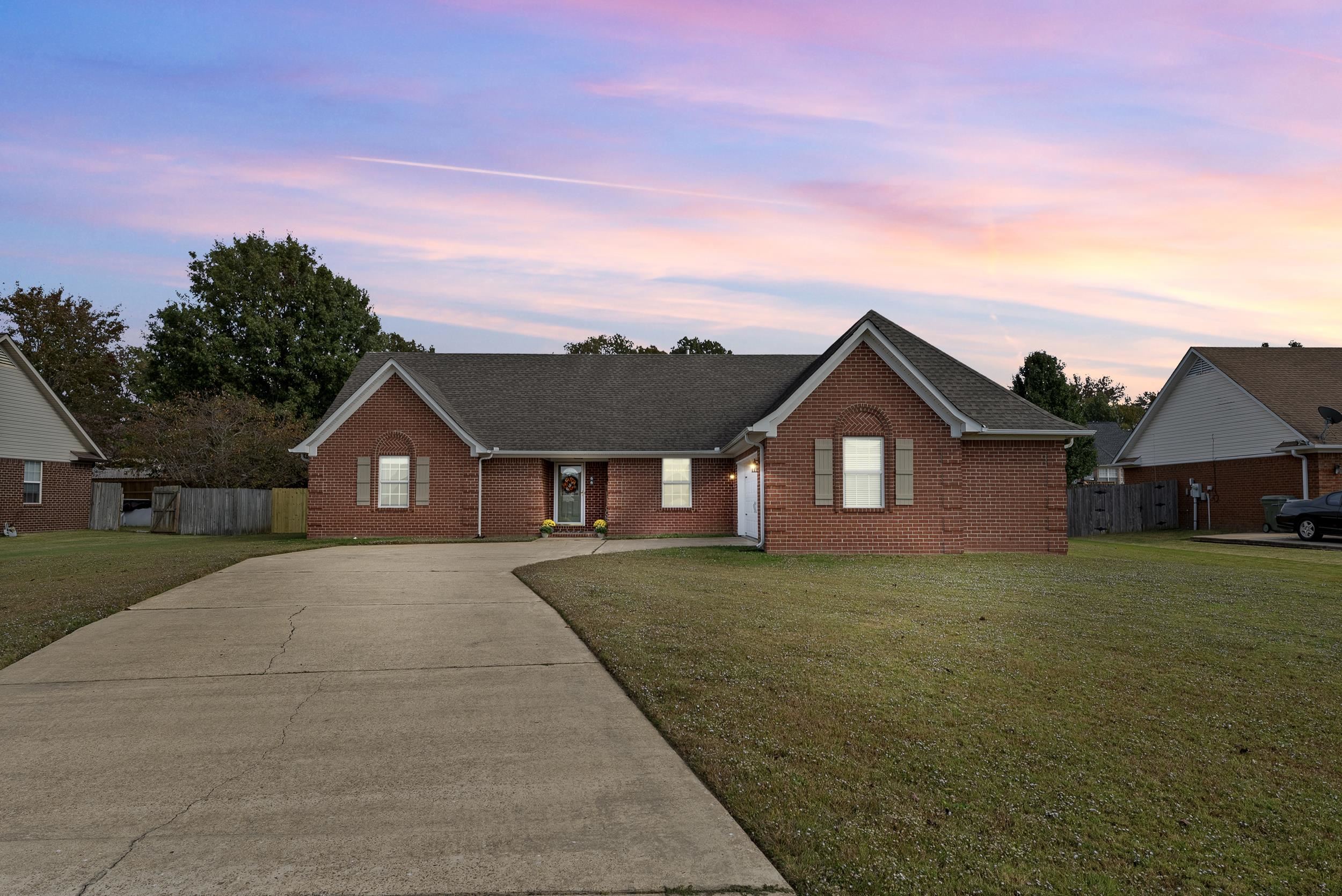 front view of a house with a yard