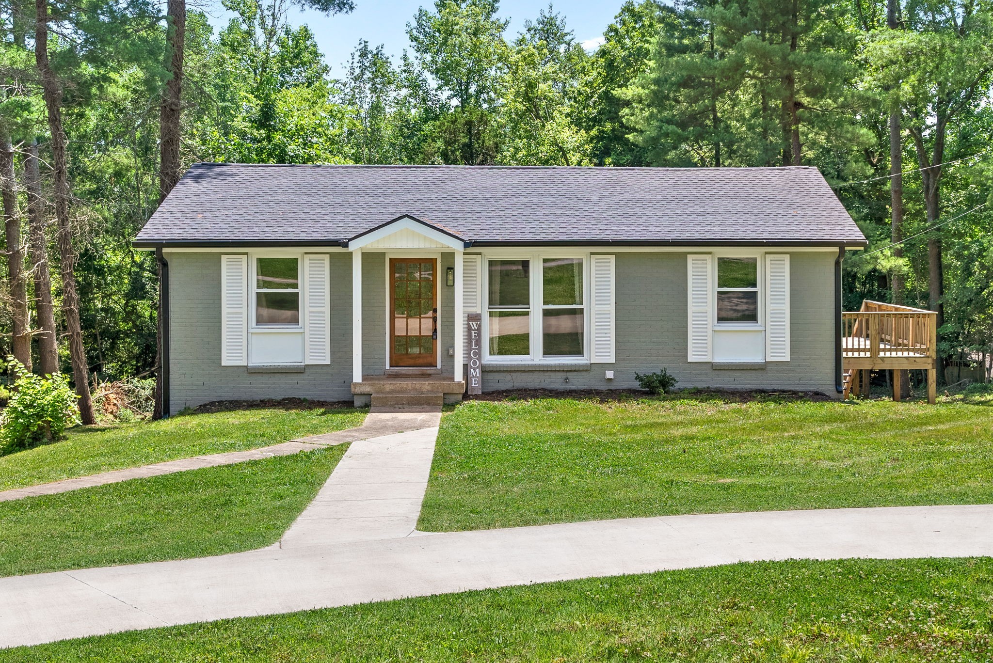 a front view of a house with a yard