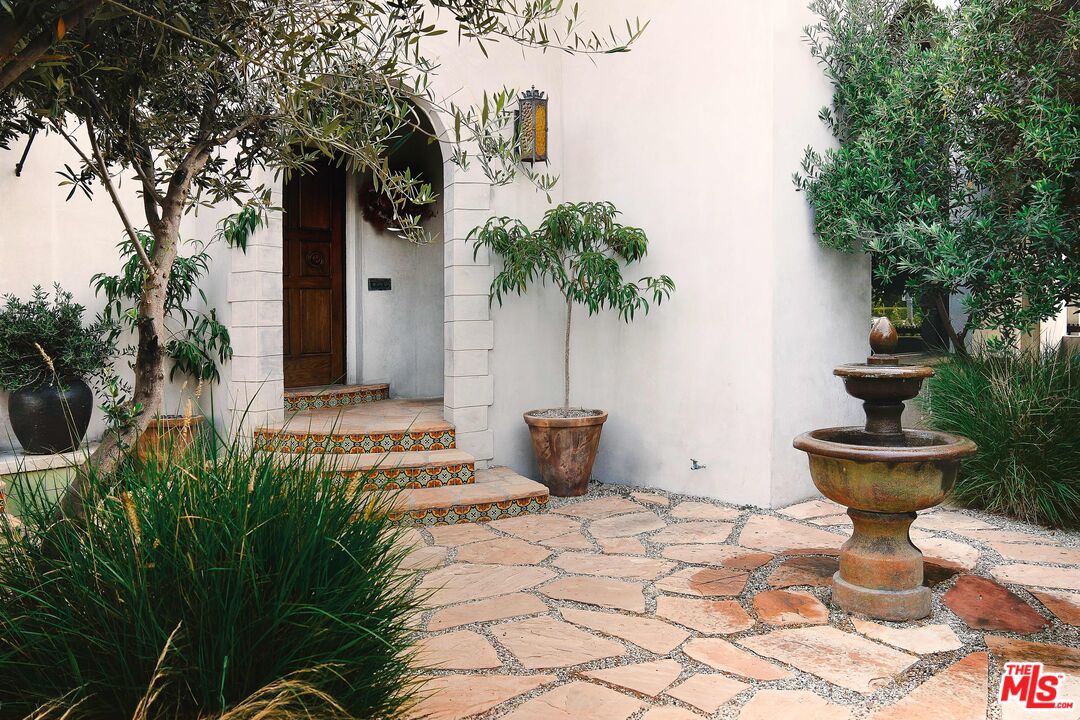 a view of a terrace with garden and trees