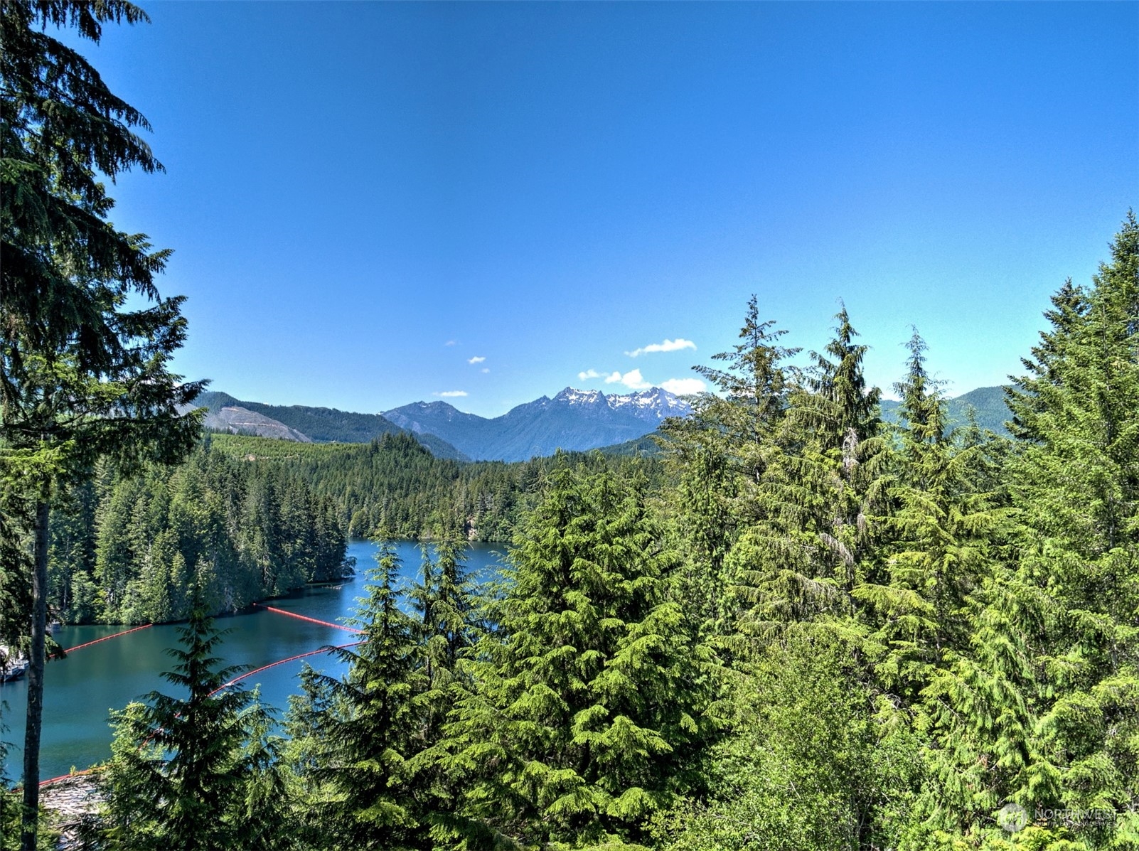 a view of a lake with a house in the background