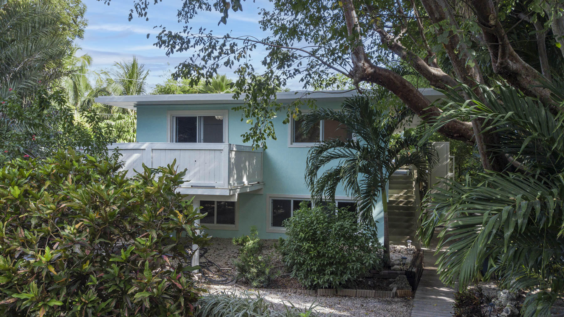 a view of a house with a tree