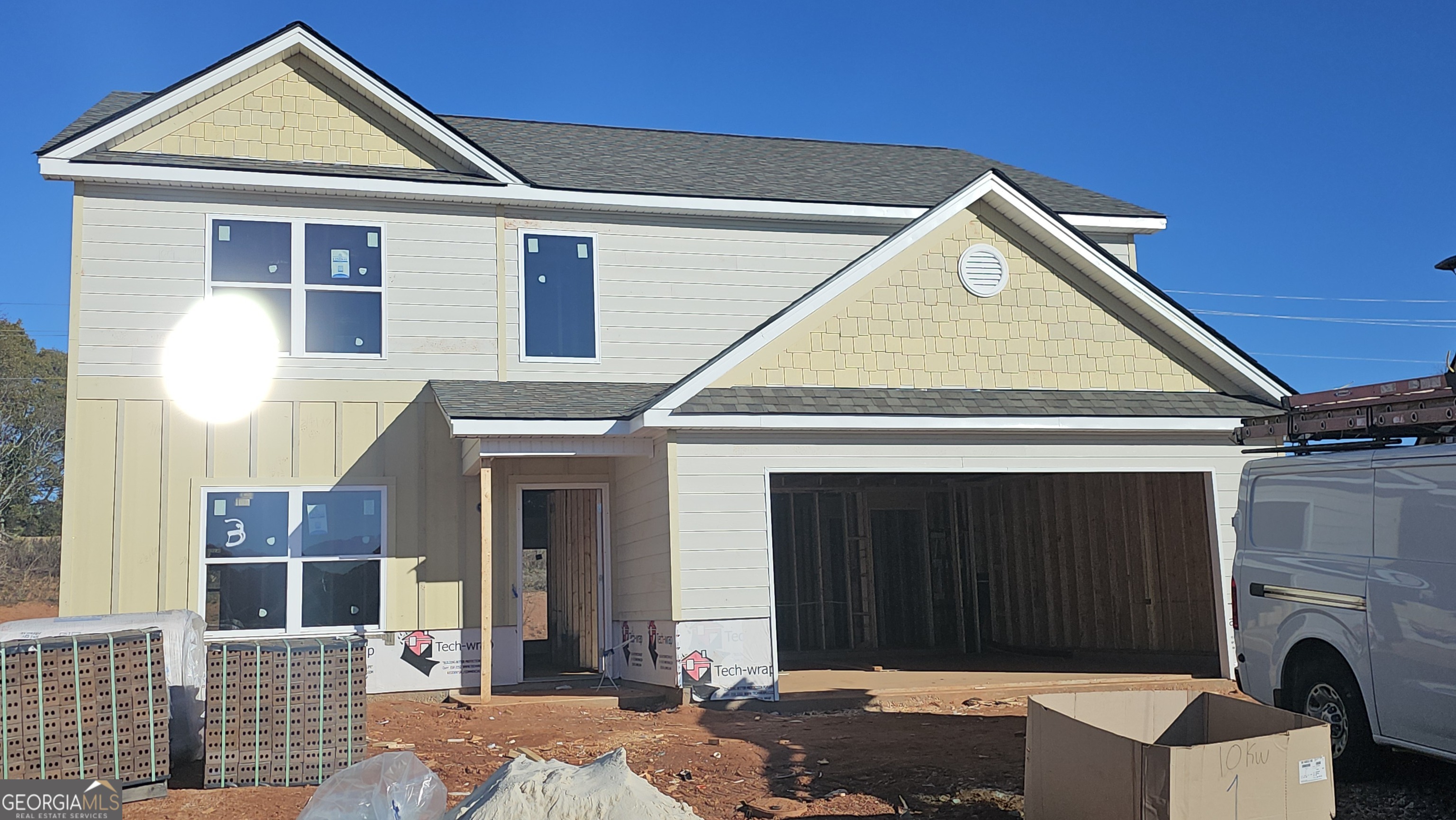 a front view of a house with a garage