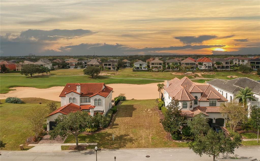 an aerial view of residential building with outdoor space ocean view