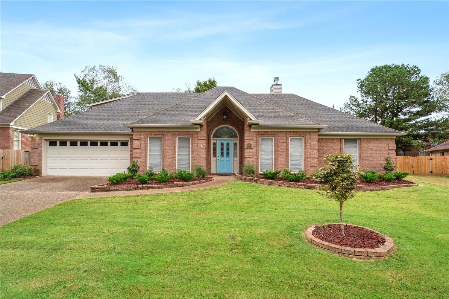 a front view of a house with a yard