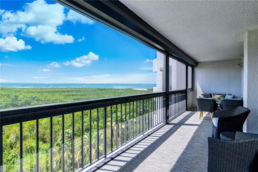 a view of a balcony with furniture