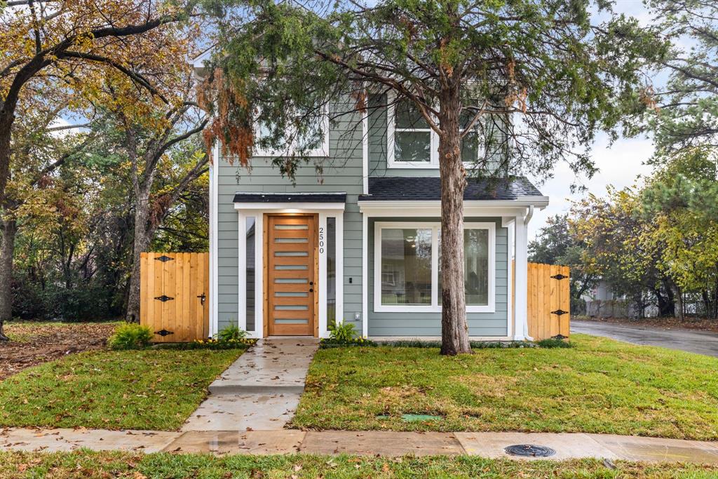 front view of a house with a yard