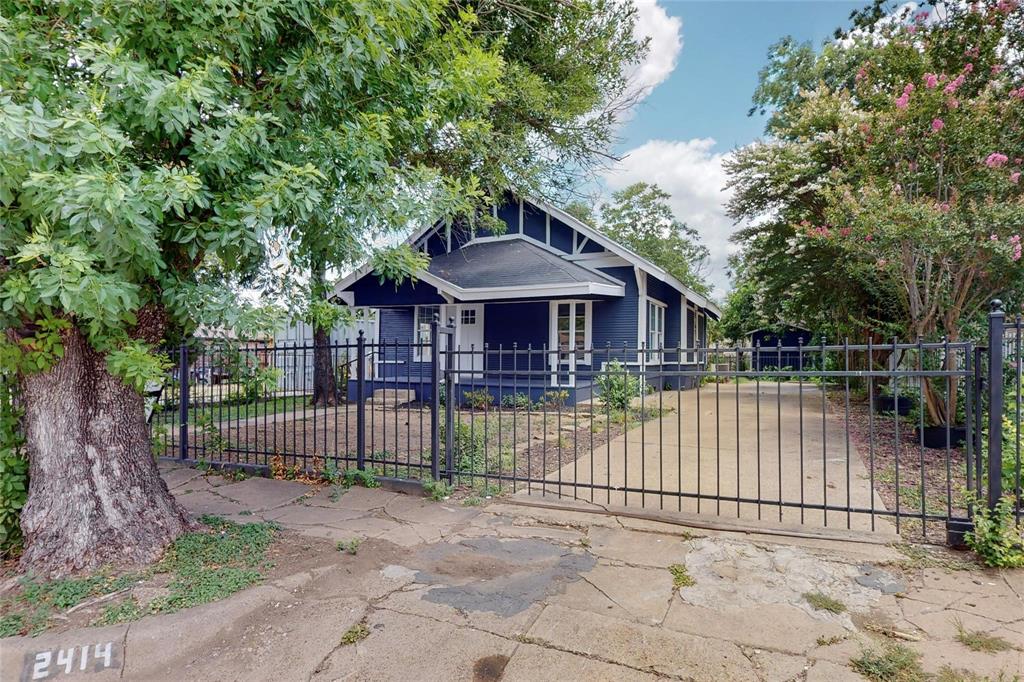 a view of a wrought iron fences in front of house