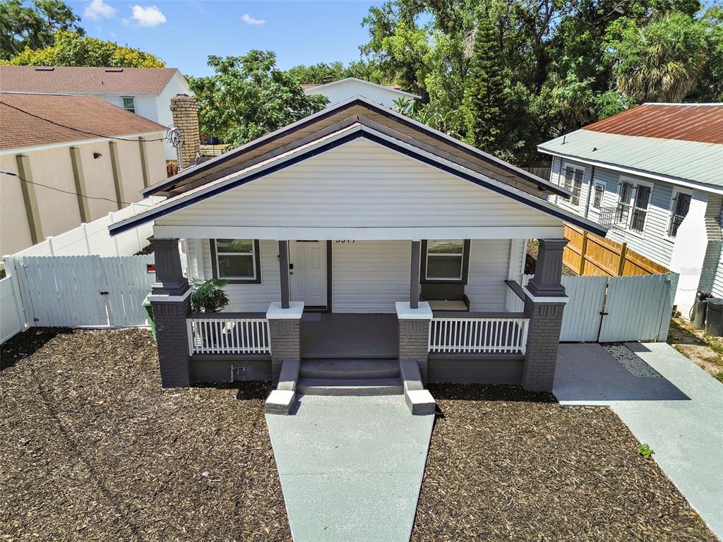 a view of house with a deck and patio