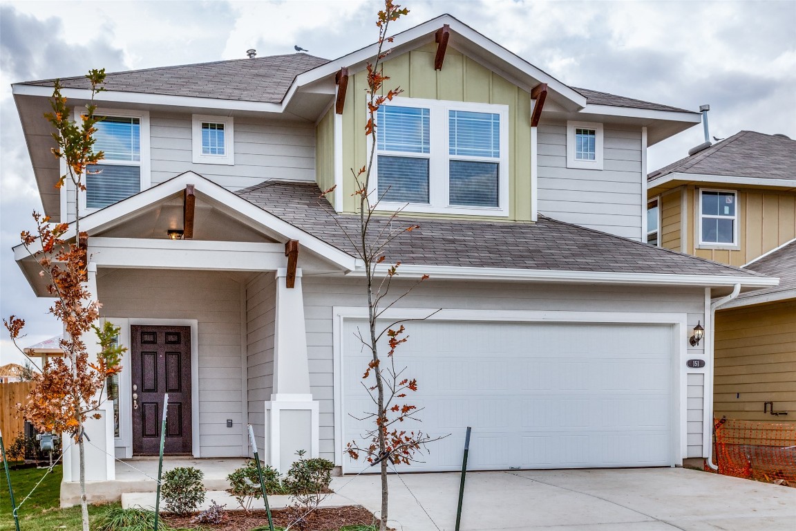 a front view of a house with a garage