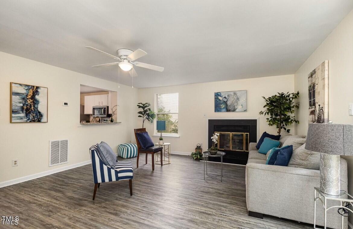 a living room with furniture and a fireplace