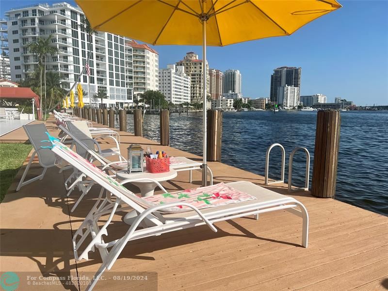 a table and chairs under an umbrella in patio