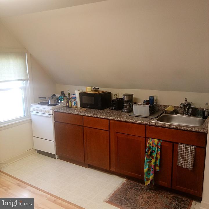 a kitchen with sink and cabinets