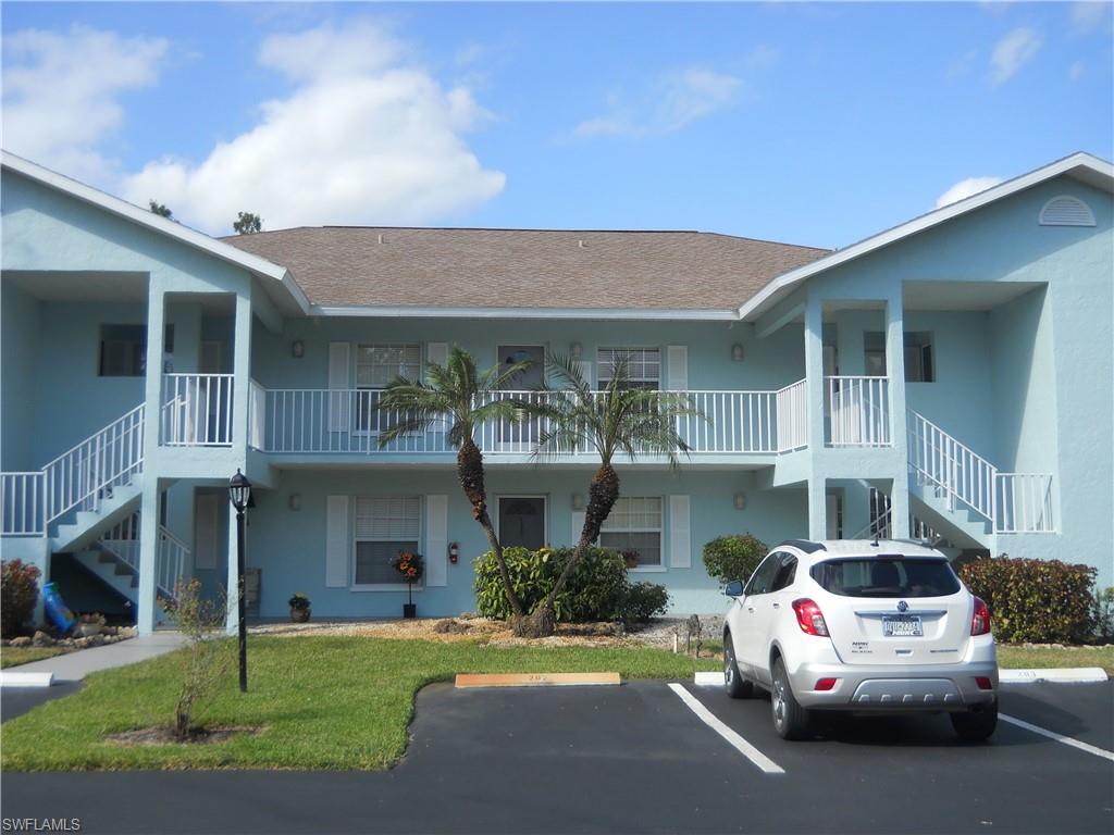 a view of a car park in front of house