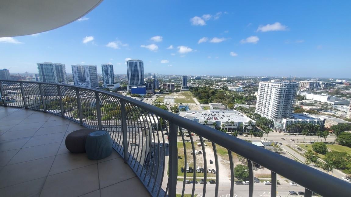 a view of a balcony with city view