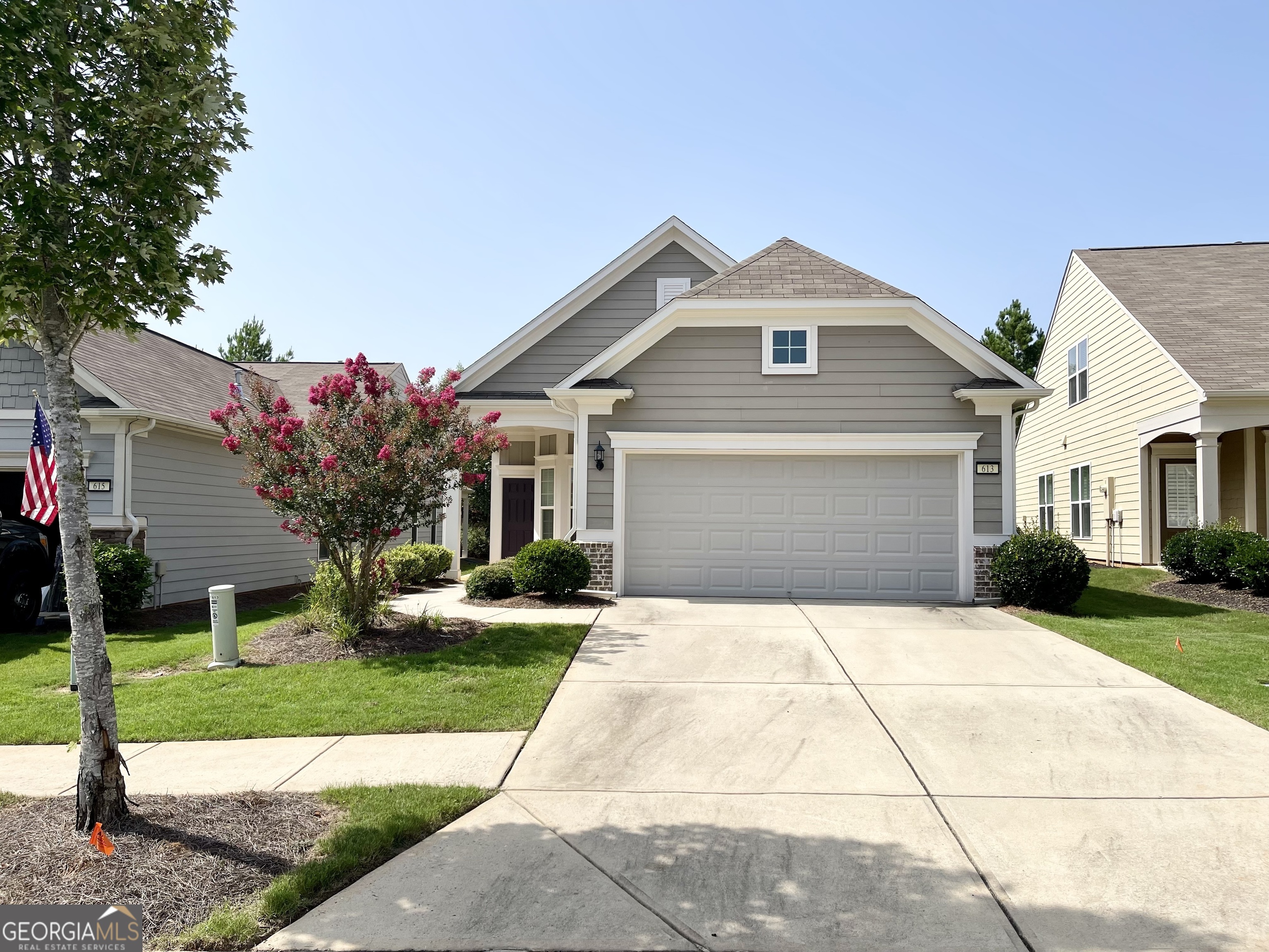 a front view of a house with yard