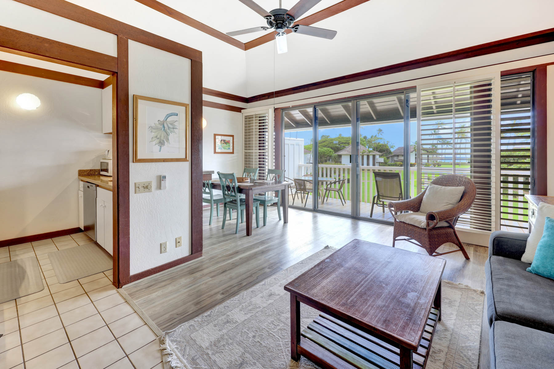 a view of a livingroom with furniture and floor to ceiling window