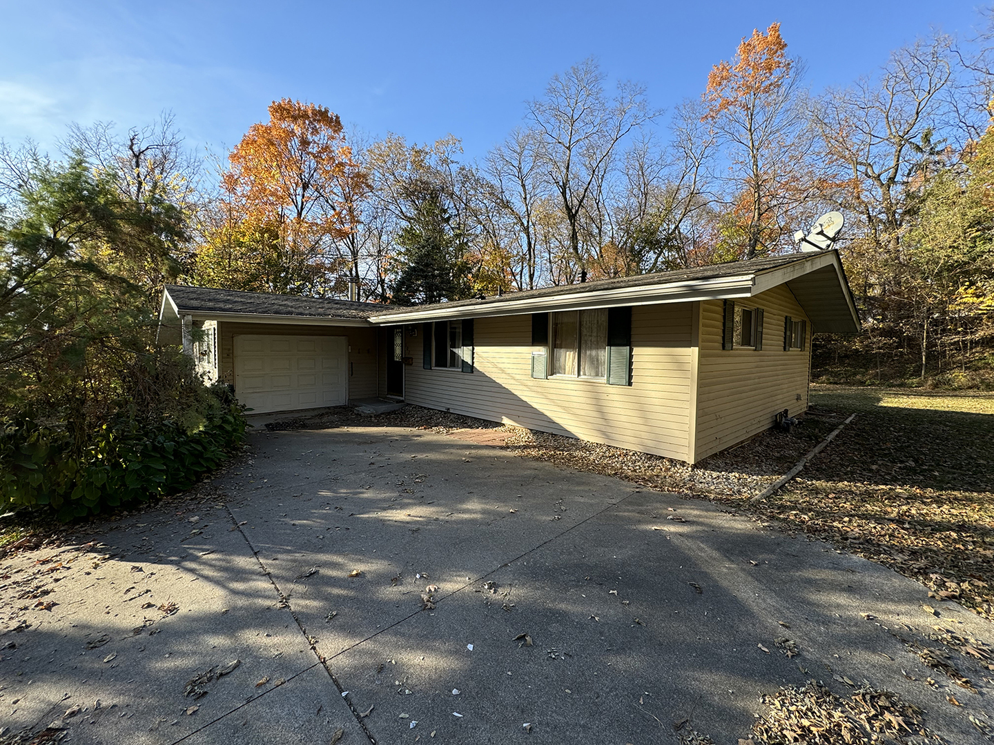 a front view of a house with trees