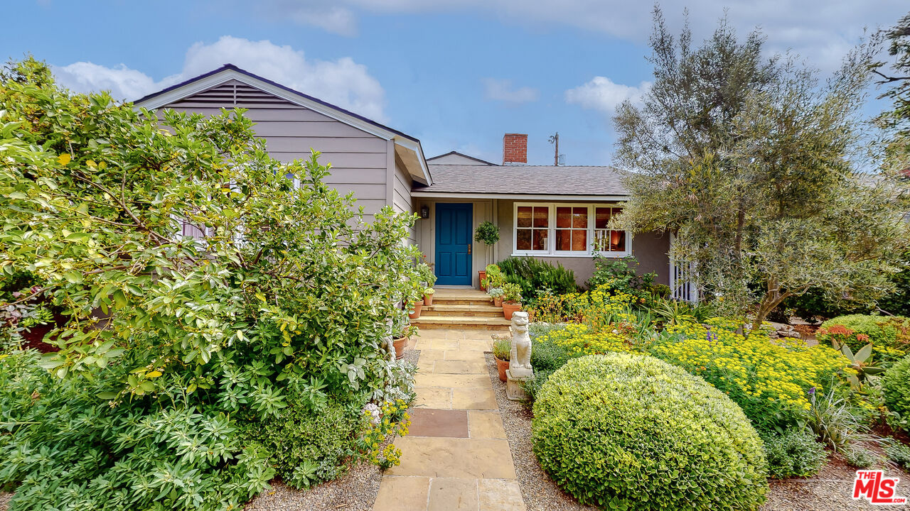 a view of a pathway in front of house